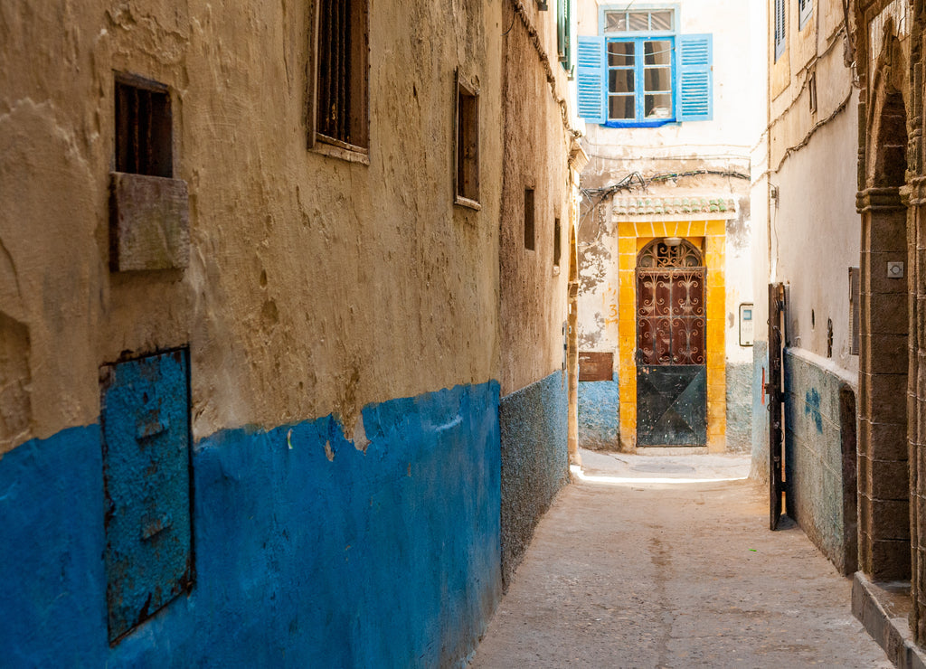 A small street in the medina of Essaouira in Morocco. The bottom of the walls is painted in blue