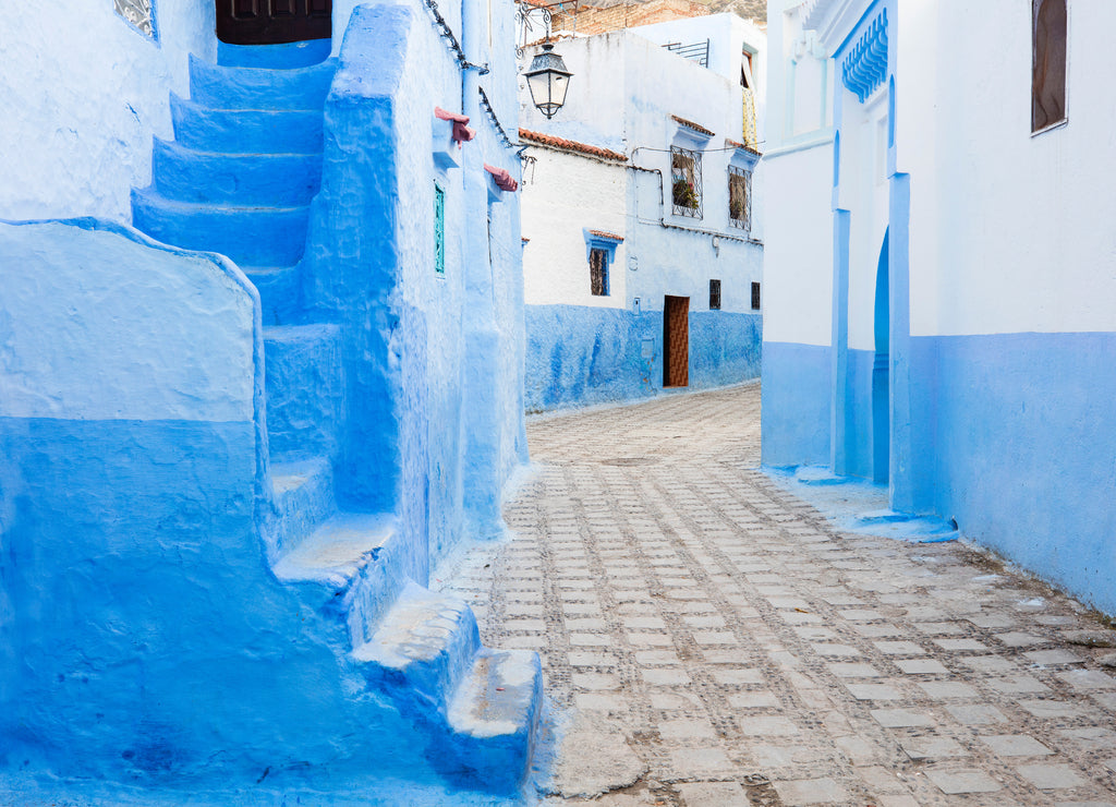 Alone silent street in blue city Chefchaouen in Morocco