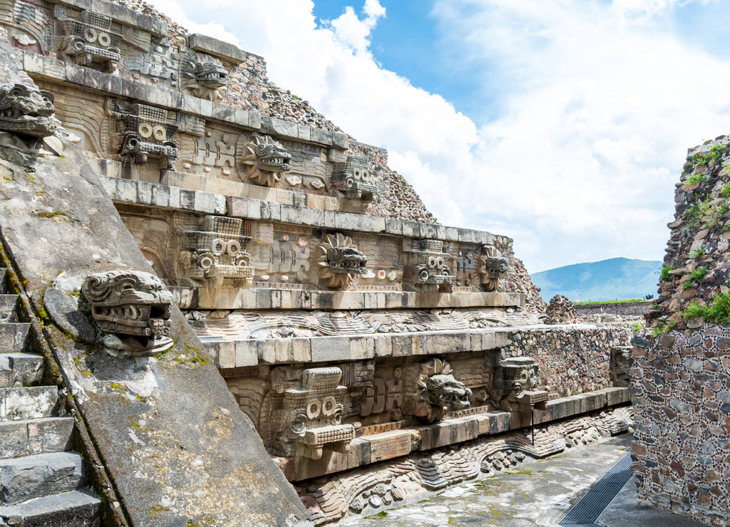 Architectural details with dragon head sink drain of Mesoamerican pyramids and green grassland located at at Teotihuacan, an ancient Mesoamerican city located in a sub-valley of the Valley of Mexico