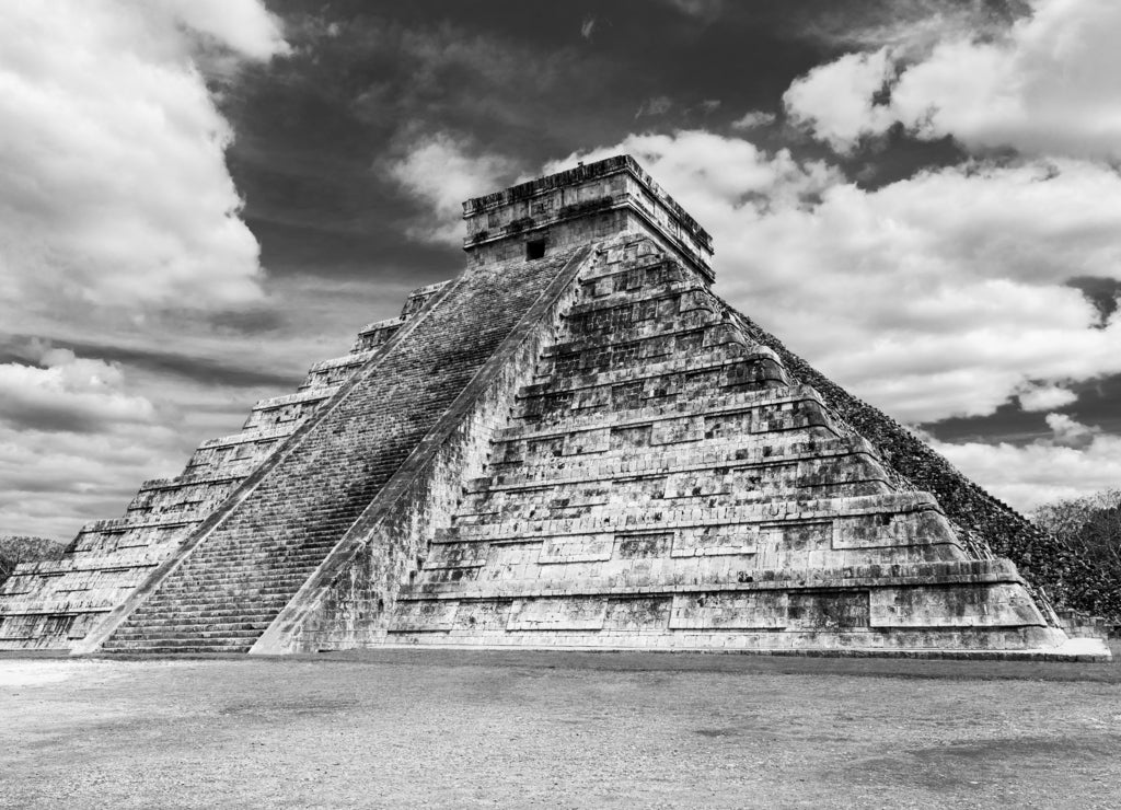 Black and White photography of the Mayan site Chichen Itza with the temple pyramid of Kukulkan