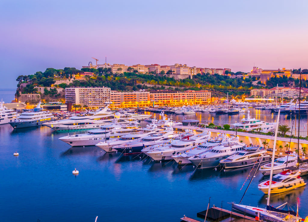 Old town of Monaco overlooking port Hercule during sunset