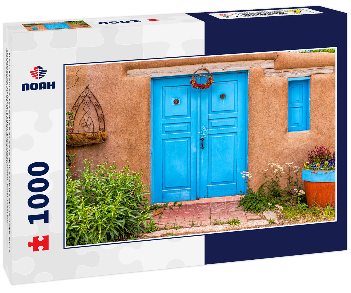 New Mexico traditional colorful architecture with blue turquoise adobe color painted door and ristras decorations at entrance garden