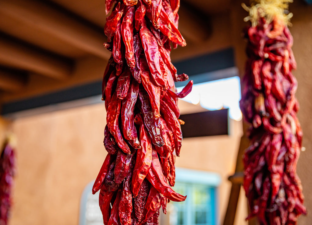 Red chili peppers dried hanging on a traditional building entrance, Santa Fe New Mexico