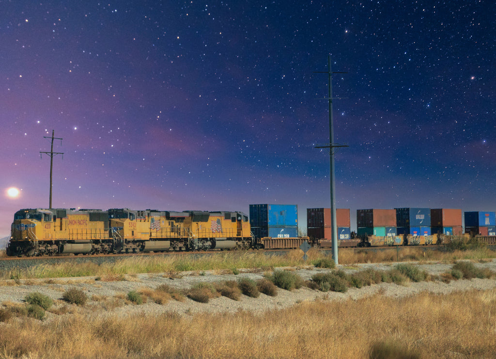Train passes the highway near Truth or Consequences New Mexico