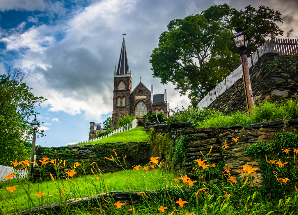 Orange lillies and St. Peters Roman Catholic Church, in Harpers, West Virginia