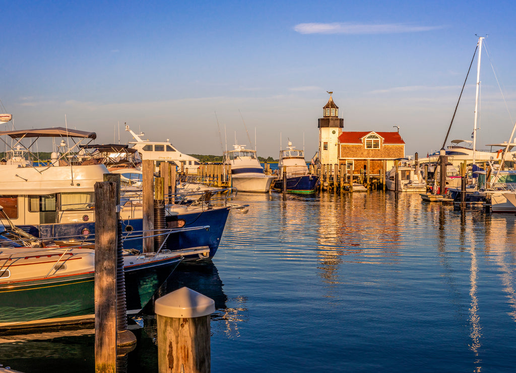 Summer evening at the marina with boats, sailboats, and lighthouse, Connecticut
