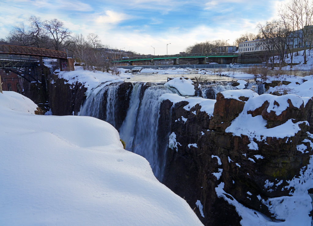 Winter view of the Great Falls of the Passaic River, part of the Paterson Great Falls National Historical Park in New Jersey, United States, after a snow