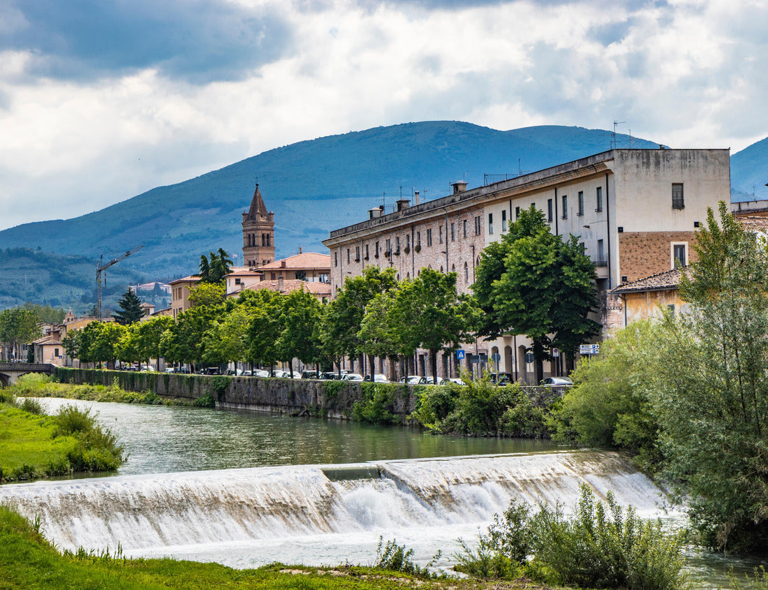 Noah Jigsaw Puzzle A view of Foligno, crossed by the river Topino, a bell tower rises above the roofs of the houses. The cloudy sky at sunset 1000 pieces