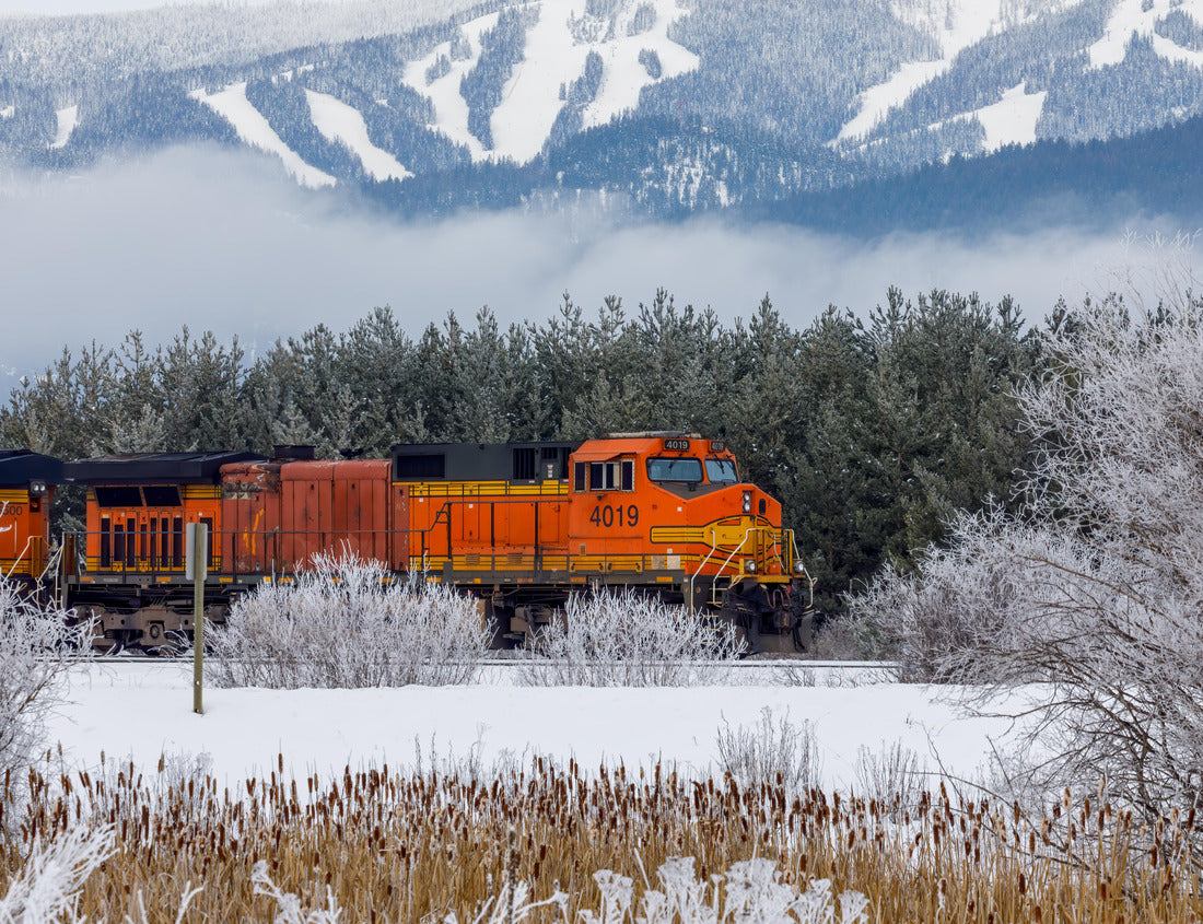 Noah Jigsaw Puzzle Locomotive pulling train in winter close to Whitefish, Montana with Whitefish ski resort in background 1000 pieces