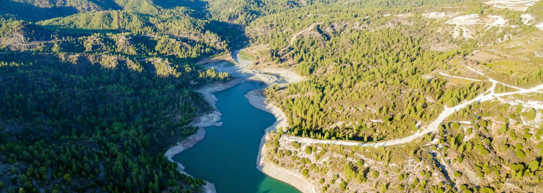 Noah Jigsaw Puzzle Aerial view of the Diarizos River in Paphos, Cyprus. The river cuts through the green valley and lush forest of Laona Mountain and leads from the Arminou Reservoir to the Venetian Bridge Panorama 1000 Pieces
