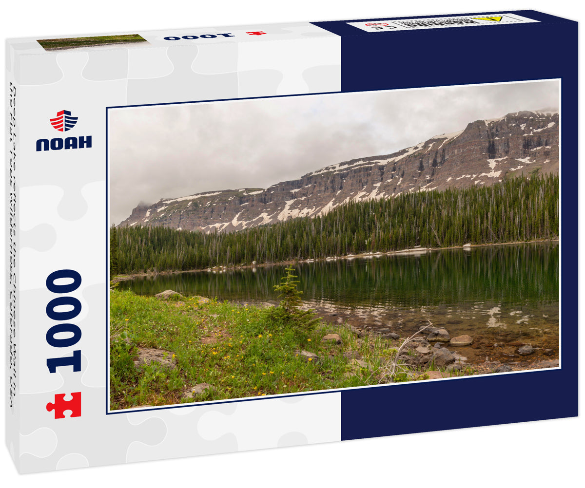 Deep Lake reflects the Chinese Wall in the Flat Tops Wilderness, Colorado, USA