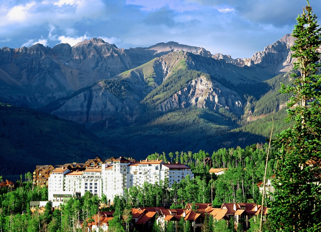 Hotel and condominiums with mountains in the backdrop in Telluride Colorado