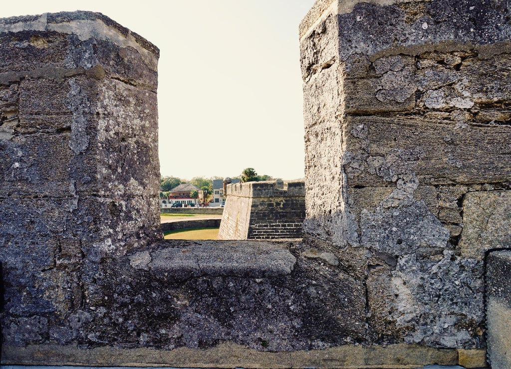 Castillo de San Marcos National Monument in Saint Augustine, Florida: Battlement with coquina parapet, crenels, draw bridge, dry moat and garrita (guard tower). Oldest masonry fort in United States