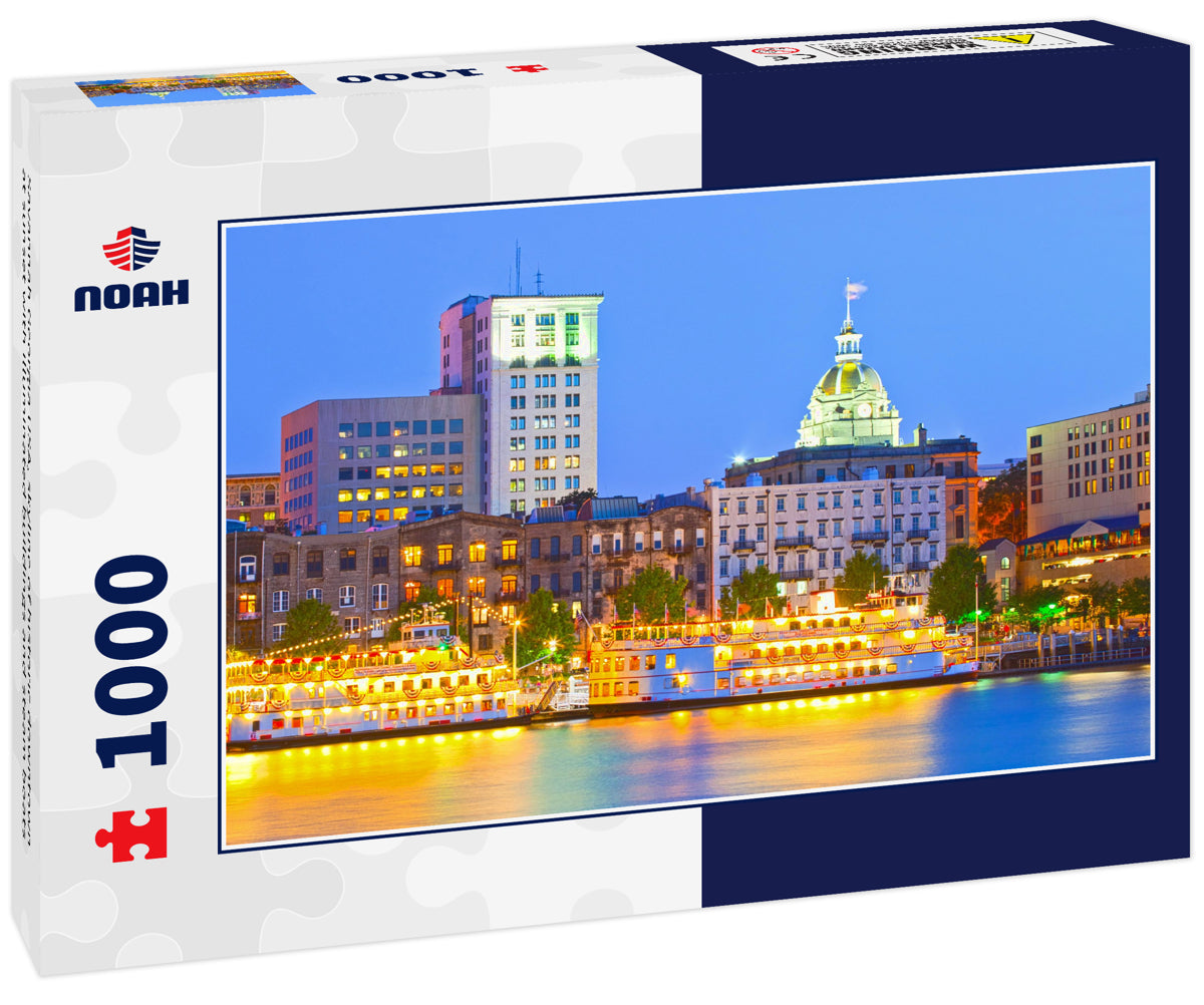 Savannah Georgia USA, skyline of historic downtown at sunset with illuminated buildings and steam boats