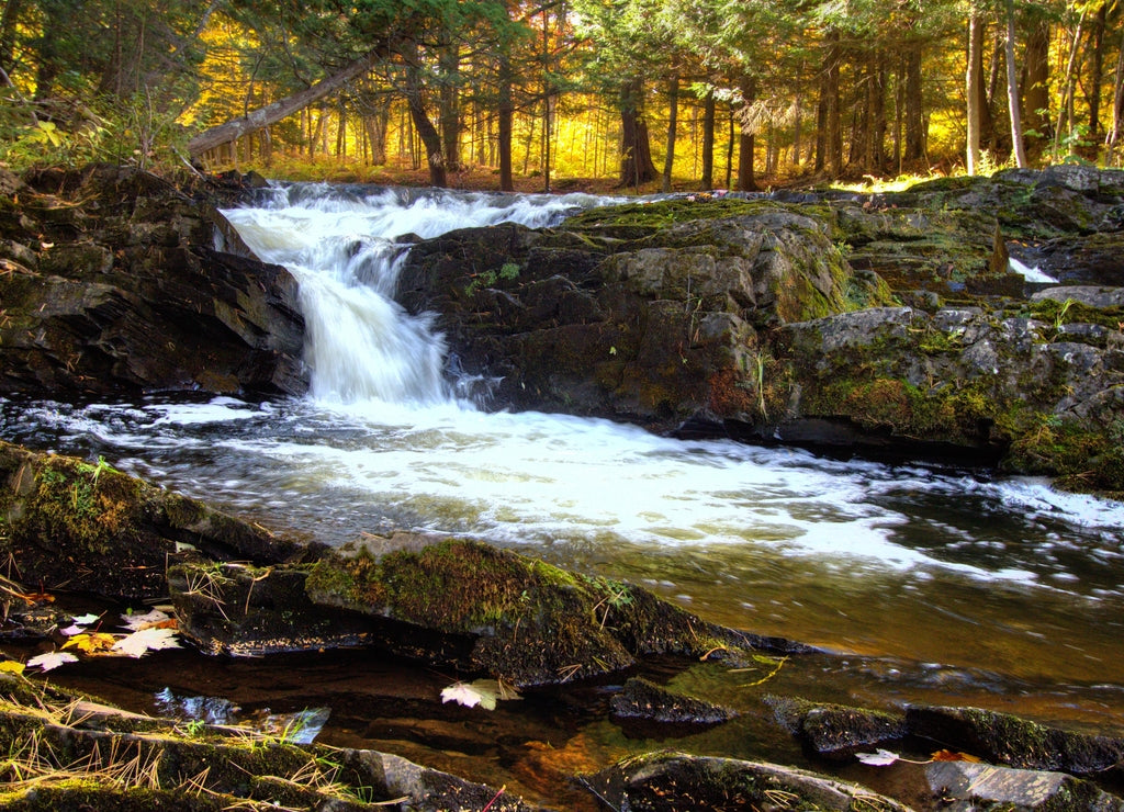 Autumn waterfall with fall foliage on the Falls River in the small town of L'Anse in the Upper Peninsula of Michigan
