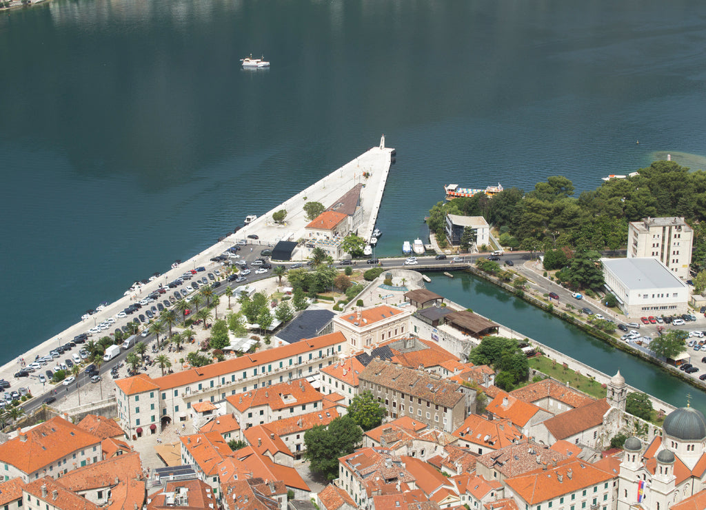 Top view of old city houses and embankment on a summer day. Kotor. Montenegro