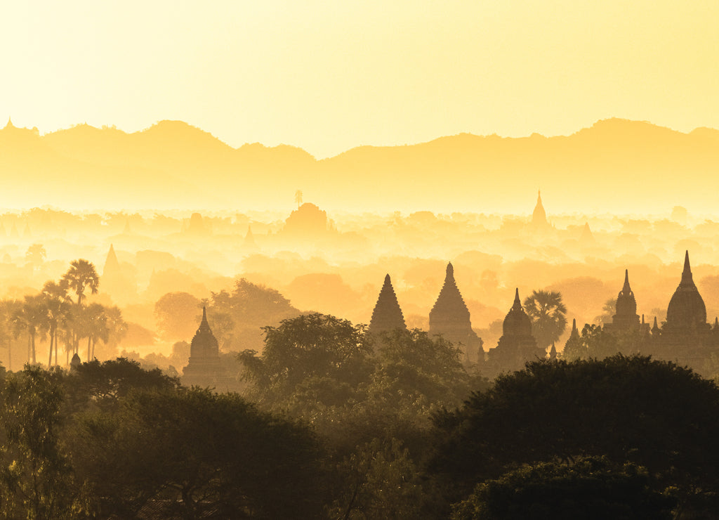 Scenic misty sunrise over Bagan in Myanmar. Bagan is an ancient city with thousands of historic buddhist temples and stupas