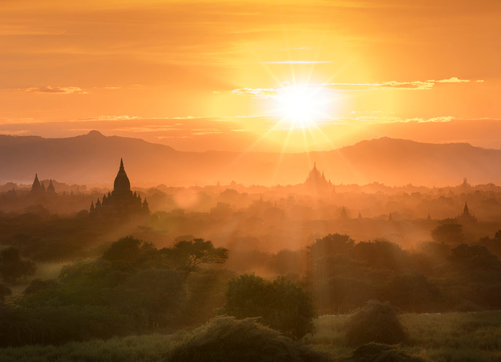 Sunset landscape view with silhouettes of old Bagan temples, at Bagan Archaeological Zone Bagan Mandalay Myanmar (Burma)