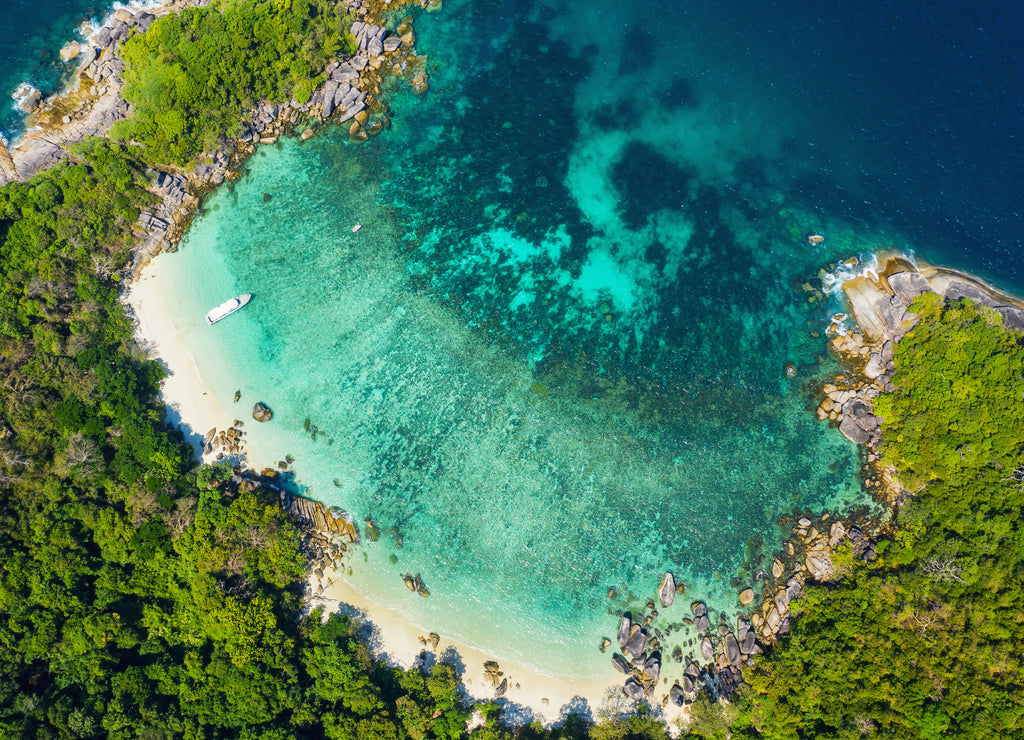 Aerial view drone shot ocean waves, Beautiful tropical beach and rocky coastline and beautiful forest. Nga Khin Nyo Gyee Island Myanmar. Tropical seas and islands in southern Myanmar