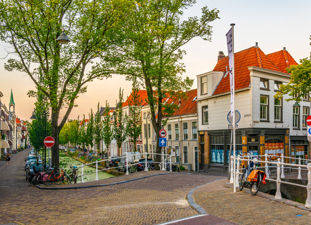 Sunset view of a channel in Delft, Netherlands