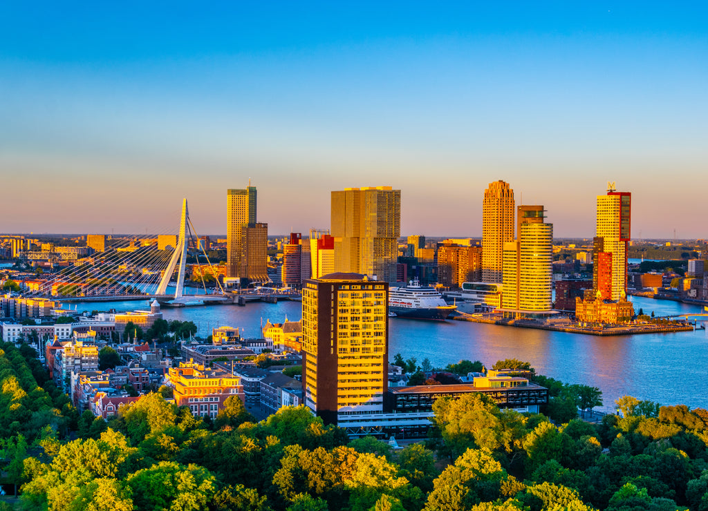 Sunset aerial view of Erasmus bridge and skyline of Rotterdam, Netherlands