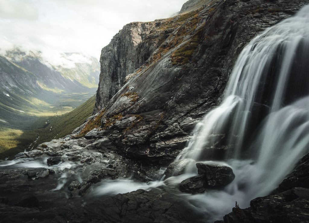 Waterfall between sharp exposed rocks, in Norway