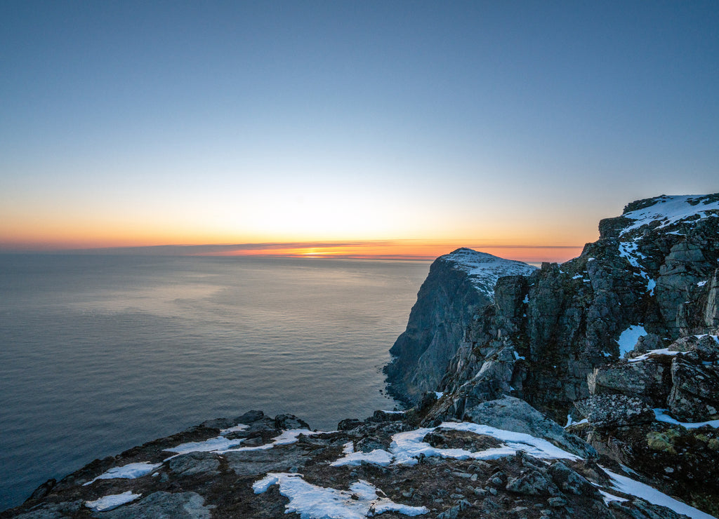 Landscape shot from Ryten looking west towards sunset in Lofoten island in Norway during blue hour