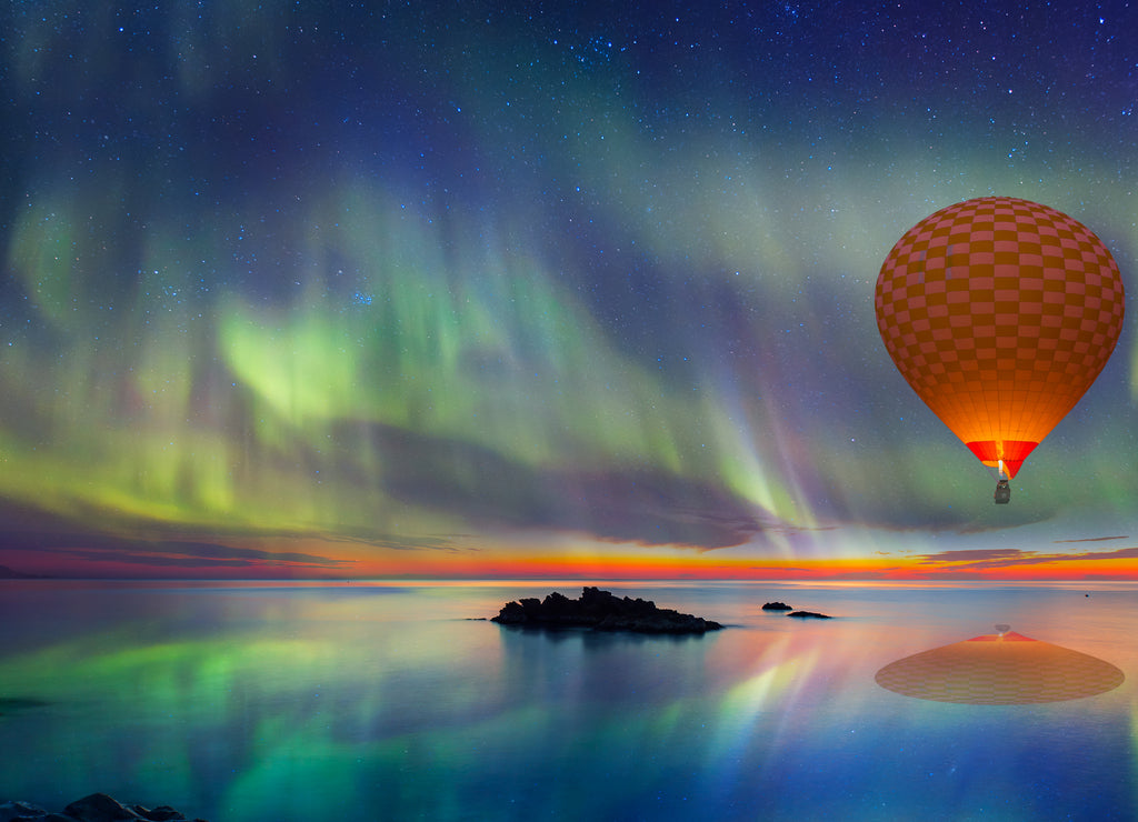 Hot air balloon flying with spectacular Northern lights - Northern lights (Aurora borealis) in the sky over Tromso, Norway