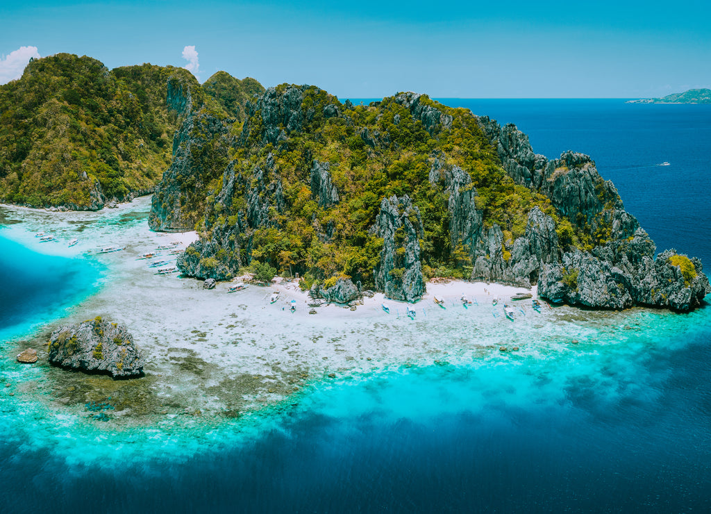Aerial drone view of tropical Shimizu Island and pristine beach in blue ocean El Nido, Palawan, Philippines. Must see most beautiful famous nature spot Marine Reserve Park