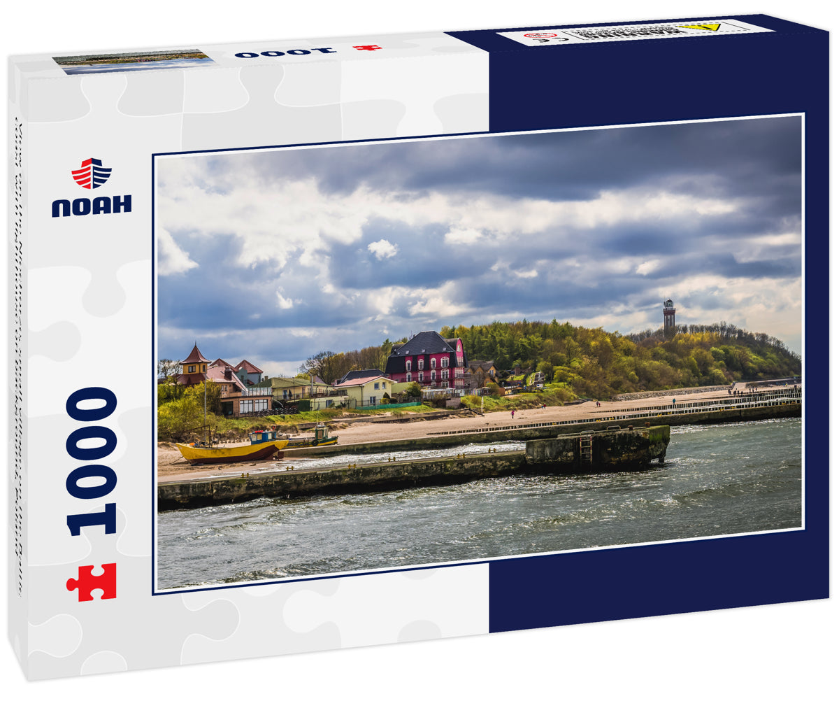 View on the Niechorze, small village on the Baltic coast with lighthouse on background, Poland