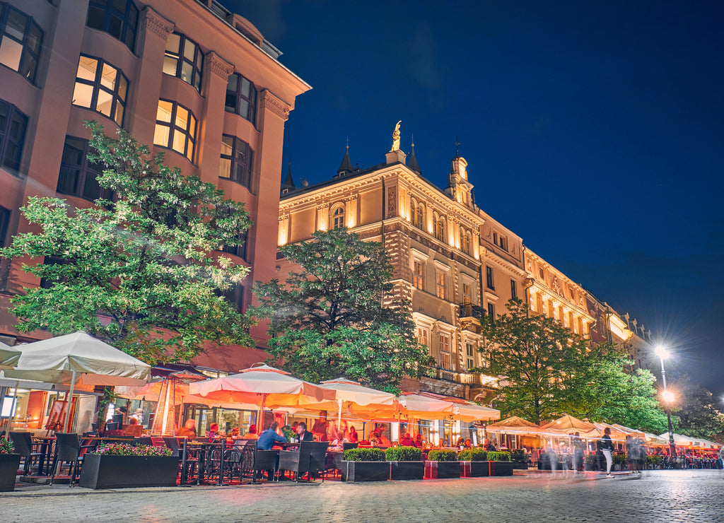 Cafes and restaurants at night in Krakow, Poland
