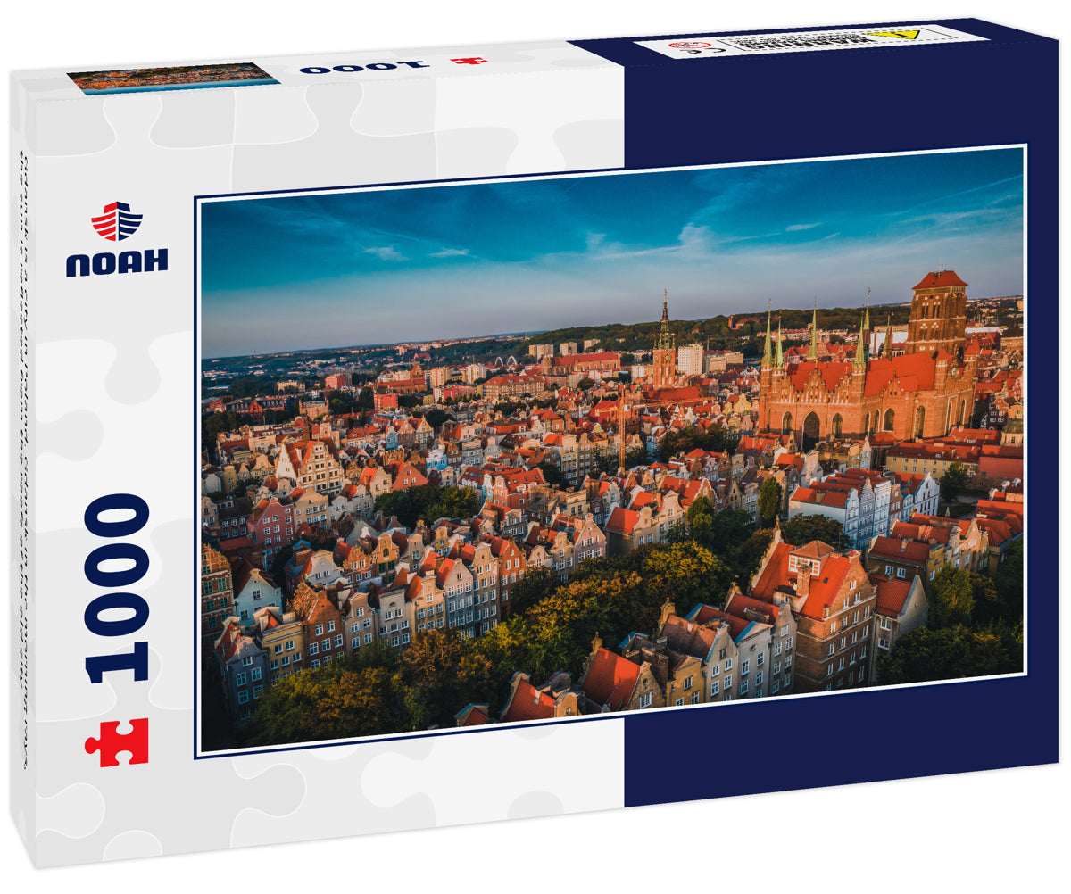 Gdansk is a city in Poland. Gdansk in the morning rays, the sun is reflected from the roofs of the old city