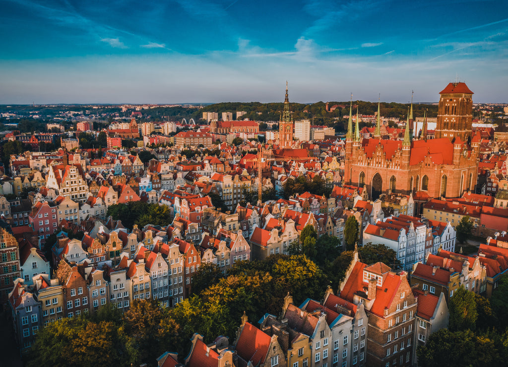 Gdansk is a city in Poland. Gdansk in the morning rays, the sun is reflected from the roofs of the old city