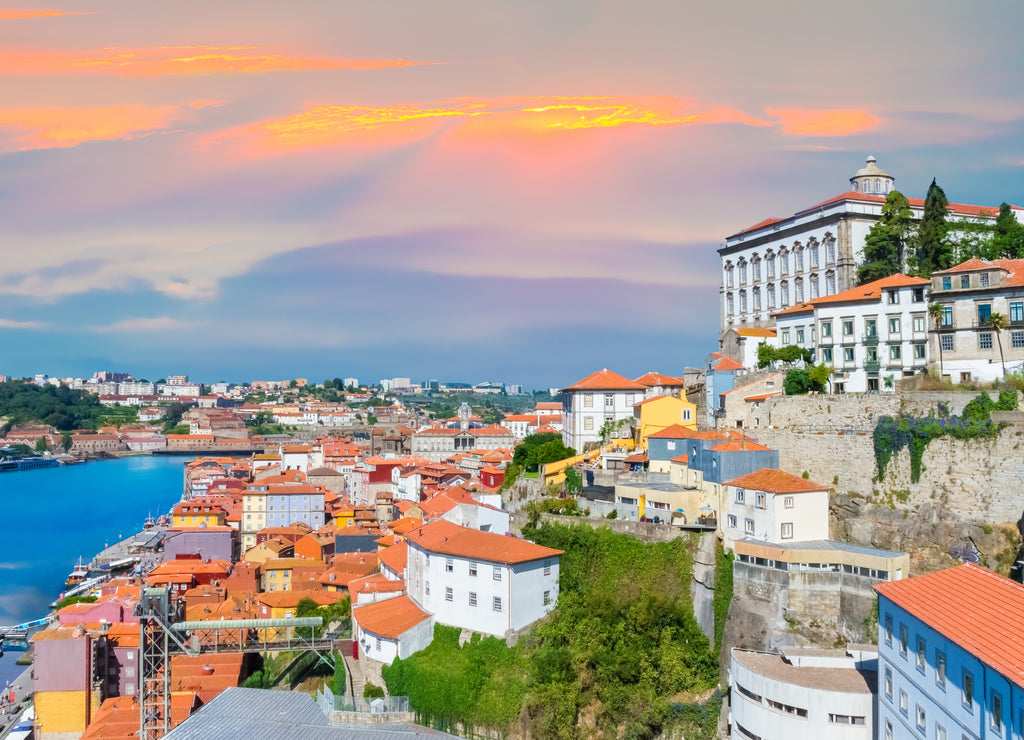 Cityscape panorama of Porto in sunset light, traditional architecture near Douro river in Portugal