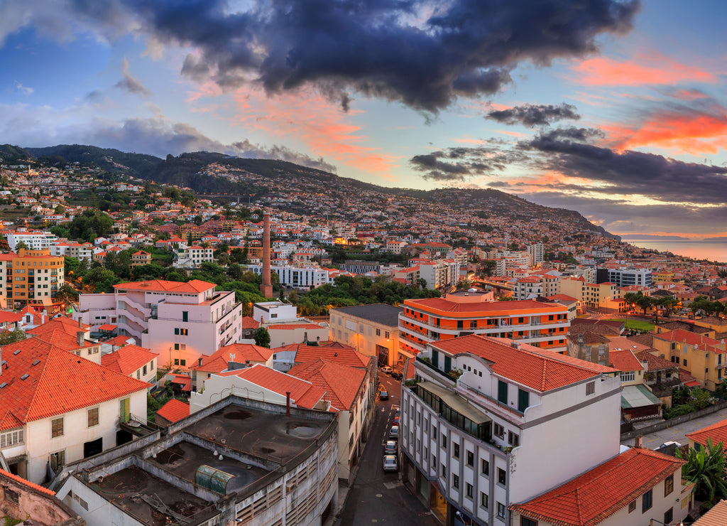 Beautiful panoramic cityscape of the skyline of the city Funchal on the island Madeira at sunrise in summer