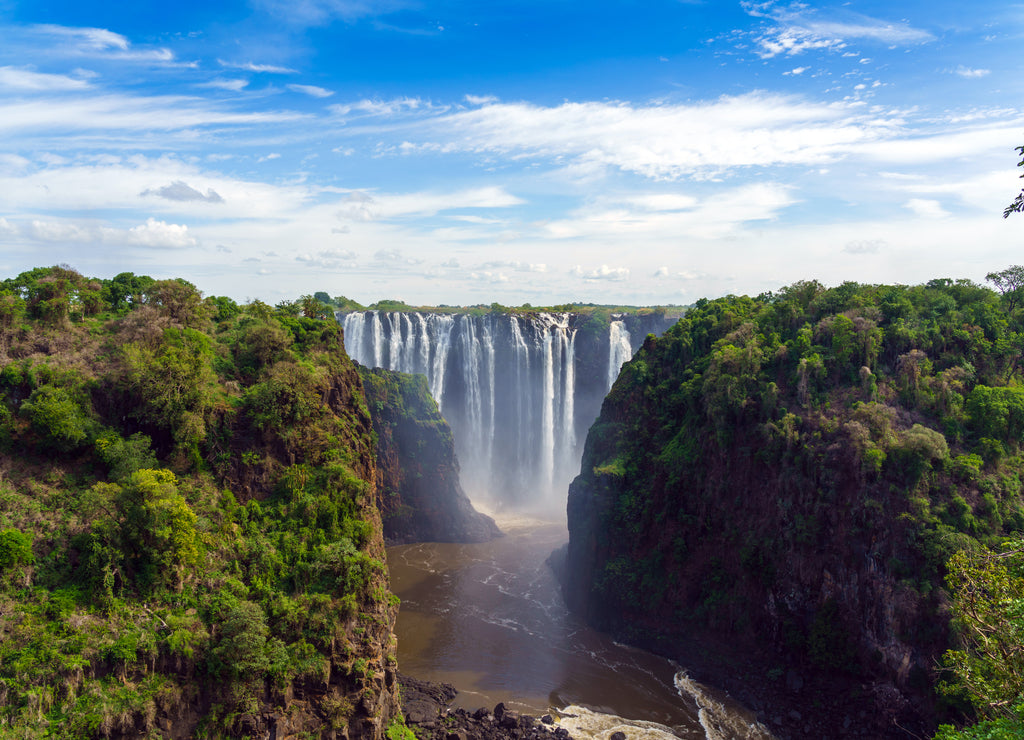 Panorama view with dramatic waterfall and clouds at Victoria Falls, Zimbabwe, Zambia
