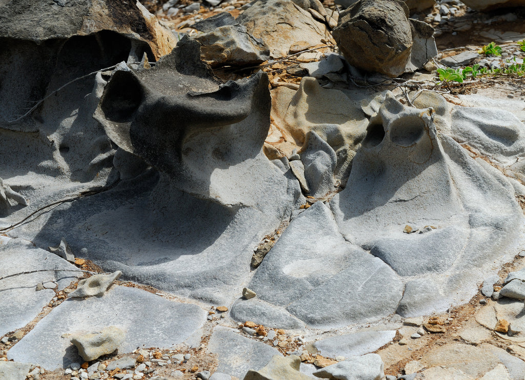 Molten rock shapes after lava hits water on North West Molokai sea cliffs Hawaii