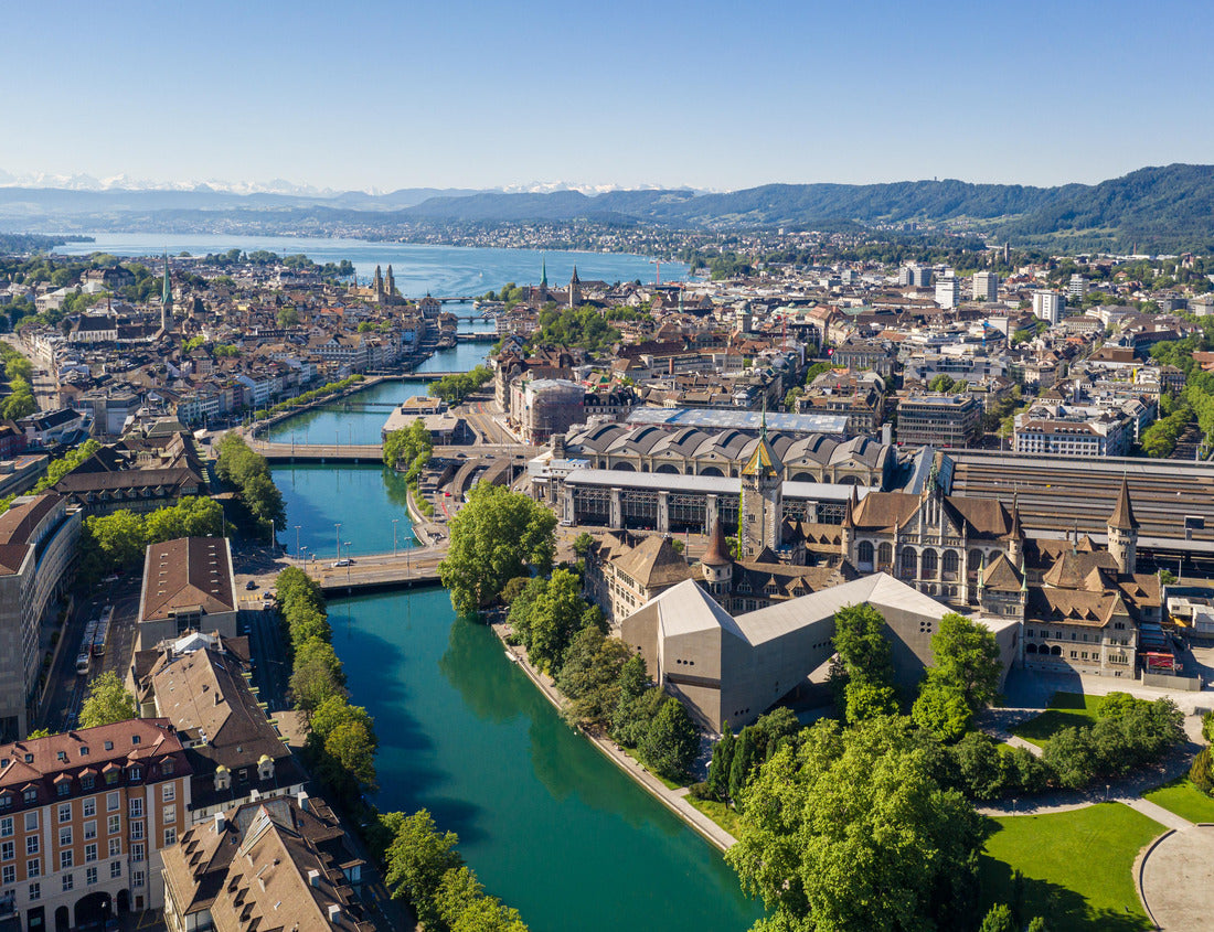 Noah Jigsaw Puzzle Aerial view of the Limmat River flowing through downtown Zurich, Switzerland, passing the National Museum, the train station and the old town, and emptying into Lake Zurich on a sunny summer's day 1000 pieces