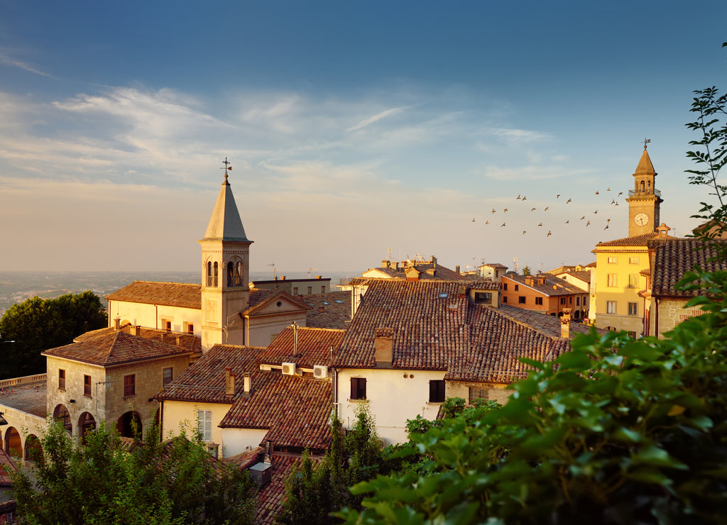 Sunset view of San Marino microstate and Emilia-Romagna region of Italy from the rooftops of the city of San Marino