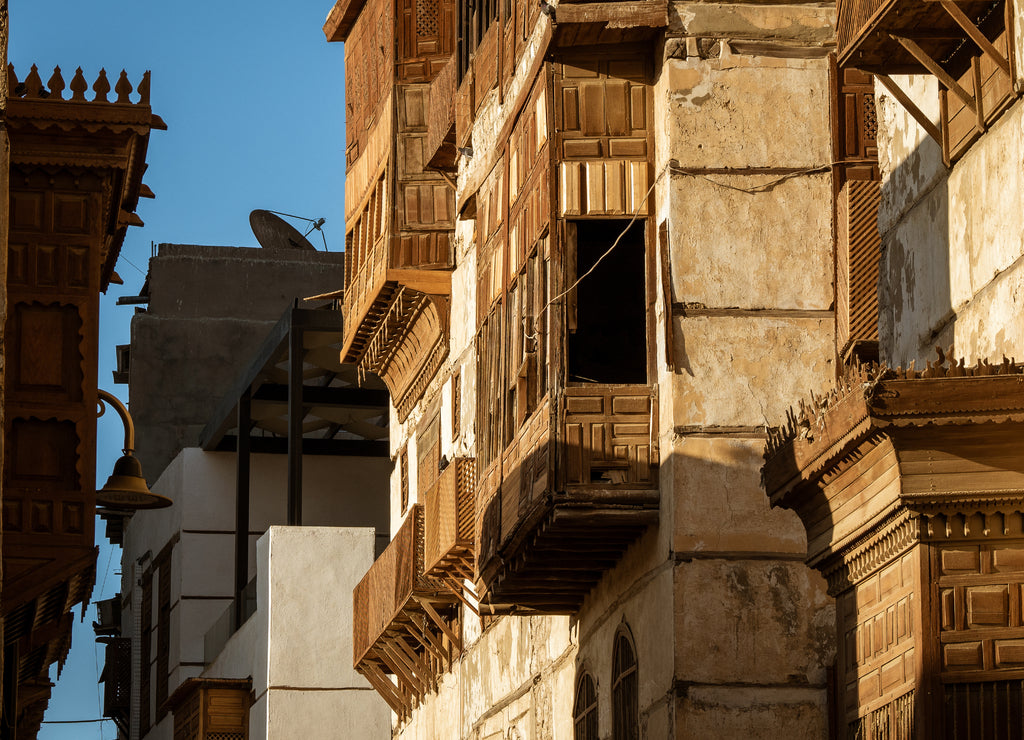 Exterior view of dilapidated traditional residential buildings at the historic district, Al Balad, old city of Jeddah, Saudi Arabia