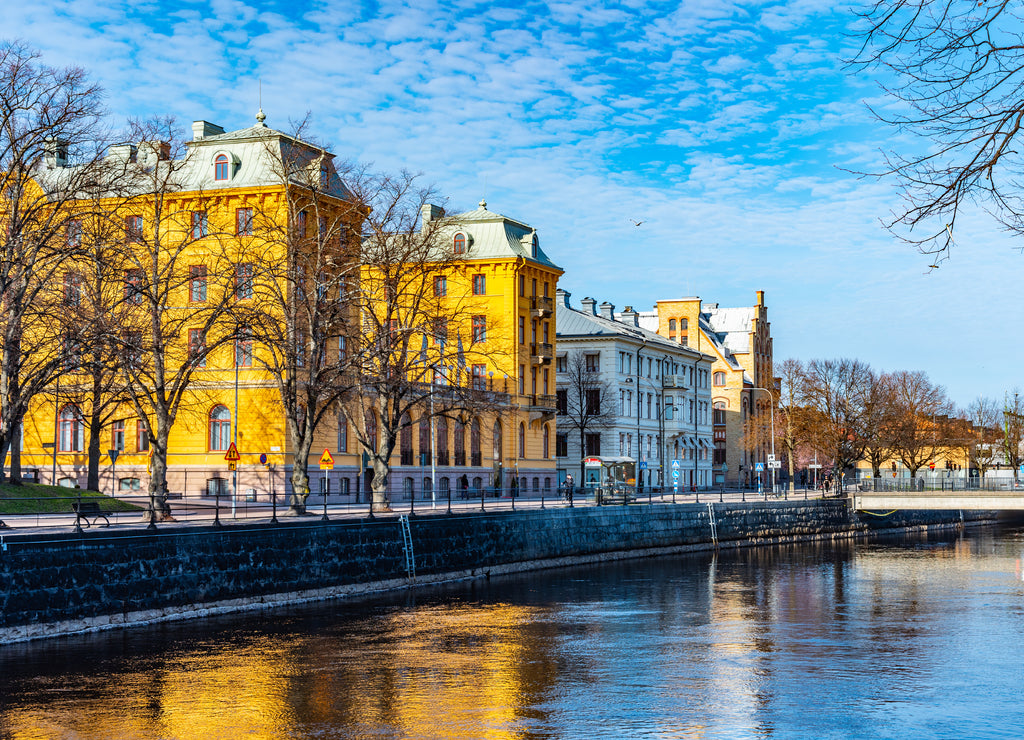Elite Grand Hotel in Gavle reflecting on river Gavlean, Sweden