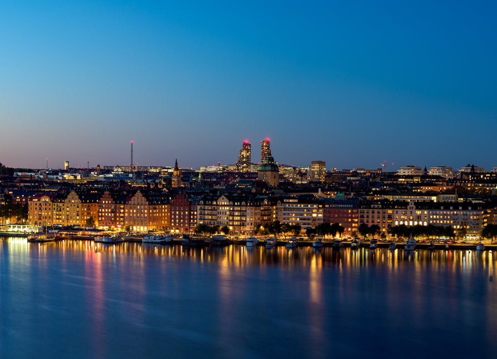 View of building by the watefront at night - Kungsholmen island in Stockholm, Sweden