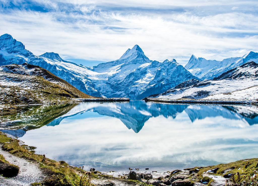 Swiss alps water reflection in Bachalpsee - mountain lake above Grindelwald, Switzerland