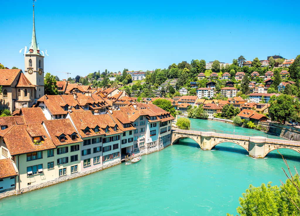 Cityscape view on the old town with Nydegg church tower and the river in Bern city in Switzerland