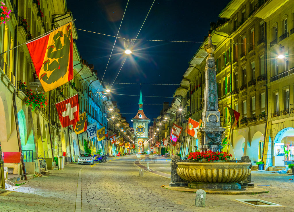 Night view of Kreuzgassbrunnen fountain on Kramgasse - the main street in Bern, Switzerland