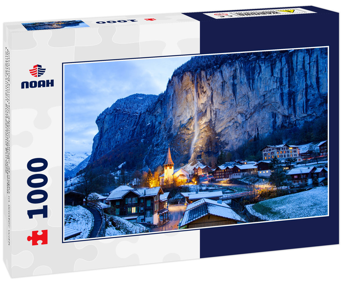 amazing touristic alpine village at night in winter with famous church and Staubbach waterfall Lauterbrunnen Switzerland Europe