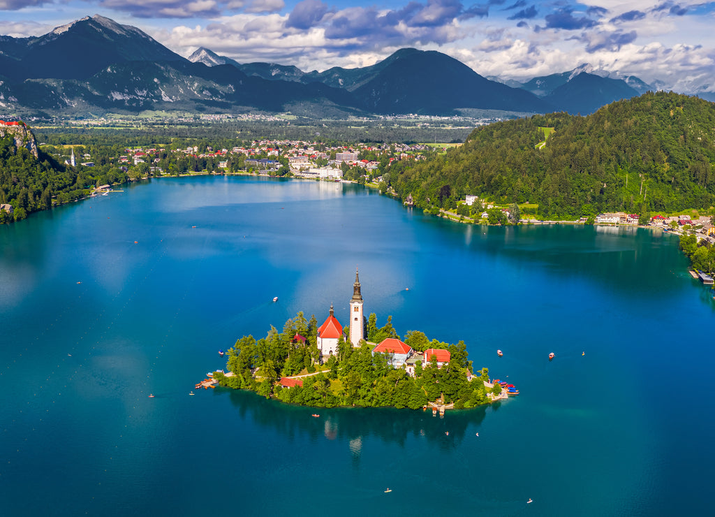 Bled, Slovenia - Aerial panoramic skyline view of Lake Bled (Blejsko Jezero) with the Pilgrimage Church of the Assumption of Maria, Julian Alps and Bled Castle