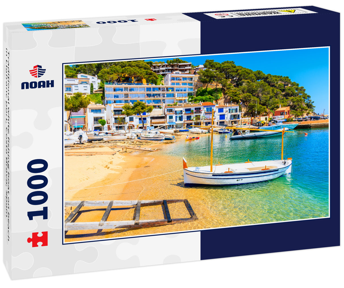 Traditional white fishing boat on beach in Llafranc port, Costa Brava, Spain