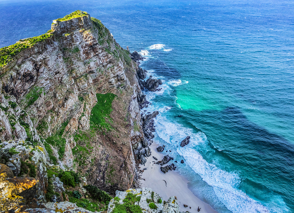 Rugged rocks and steep cliffs of Cape Point in the Cape of Good Hope Nature Reserve on the southern tip of the Cape Peninsula in South Africa