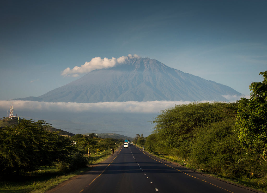 A road with Mount Meru in background, Tanzania